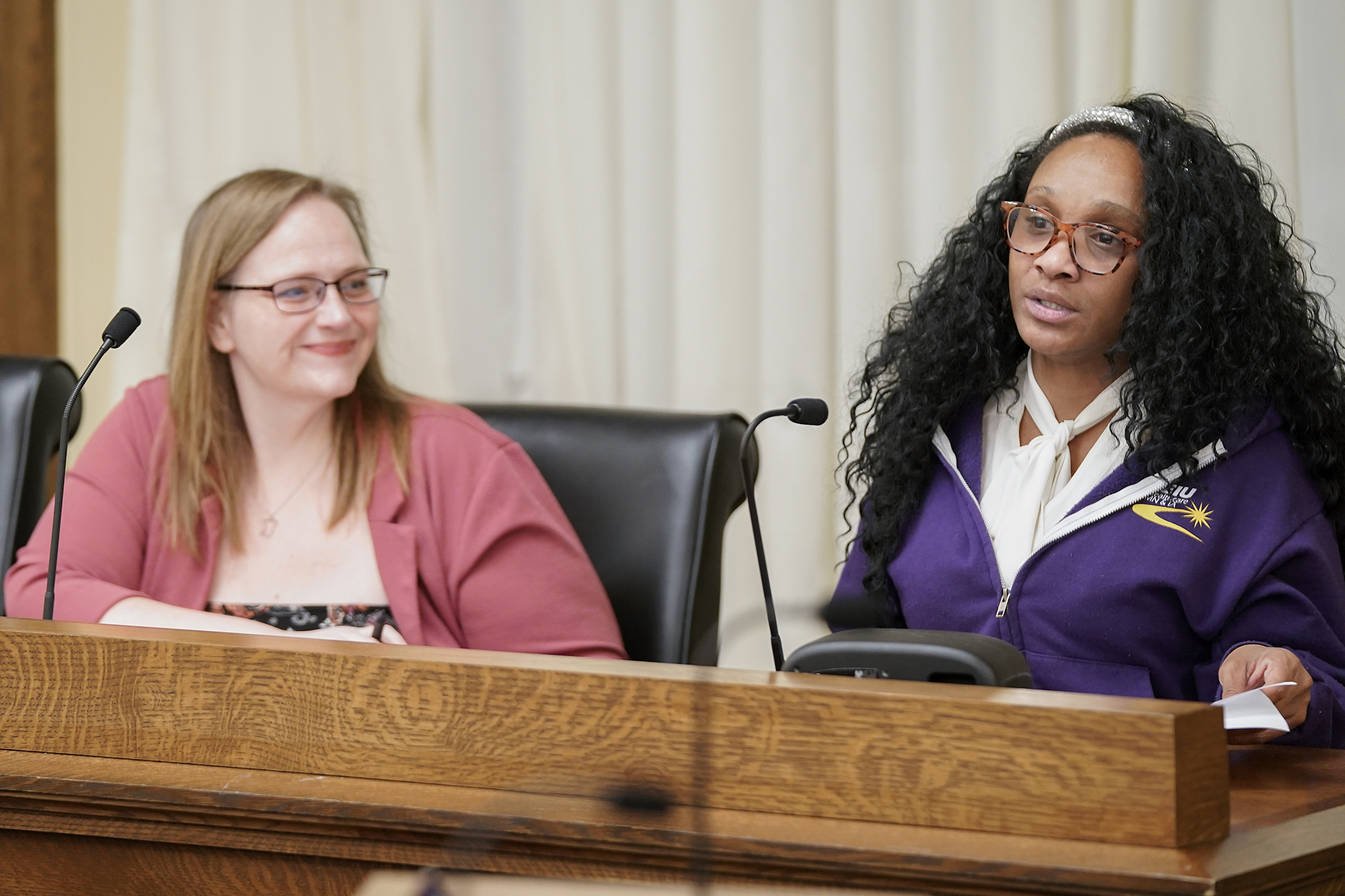 Tavona Johnson, a home care worker and executive board member of SEIU Healthcare Minnesota, testifies before the House Human Services Finance and Policy Committee March 10 in support of HF3780. Rep. Kim Hicks is the sponsor. (Photo by Michele Jokinen)